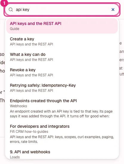 The Help center search box with "api key" typed in and a list of matching guides under it, each with the words around the match