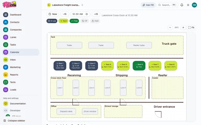 The Lakeshore Cross-Dock floor plan in the calendar’s Floor view mid-morning: dock doors In use with who’s booked at each, others Next with their time or Free, beside the yard, the staging lanes and the cooler.